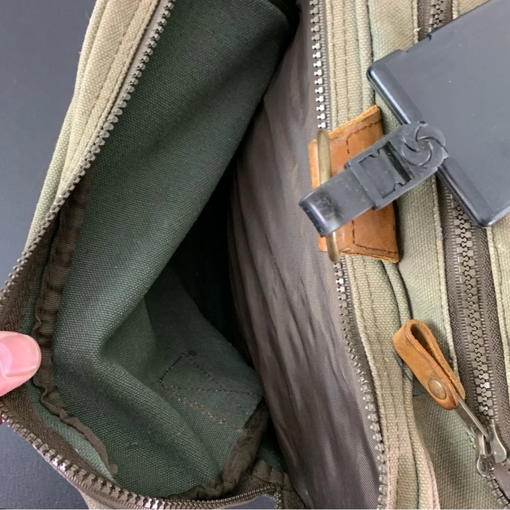 High Sierra Green canvas and Brown leather Duffel Bag.
